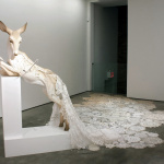 Beth Cavener. The White Hind, 2012. Stoneware, paint, 7 hand-fletched arrows, vintage lace, hand-tatted doilies, seed pearls,beads, embroidery, wooden altar H 68 x W 18 x L 50 in. Wedding Train: 300 in.